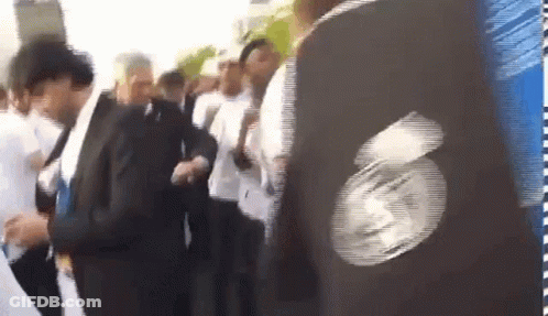People In Line, Person In Black Jacket With Face GIF