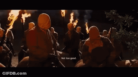 People In Masks Holding Torches Saying Not Too Good GIF