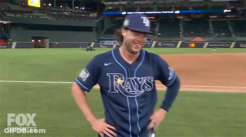 People In Rays Shirts Dancing In Crowd GIF