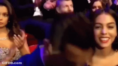 People In Stadium One Smiling At Camera GIF