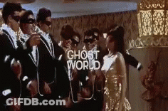 People In Suits And Masks Dancing GIF