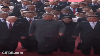 People In Suits Walking Red Carpet GIF