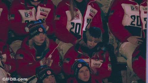 People In USA Jackets And Hats Sitting GIF