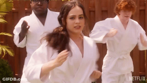 People In White Karate Uniforms Running GIF