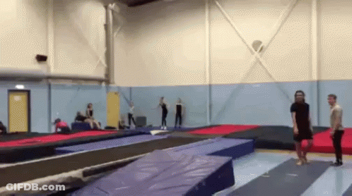 People Jumping On Trampolines GIF