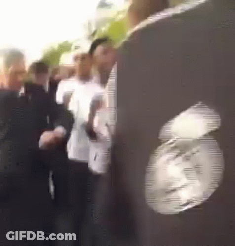People Lined Up With Clock GIF