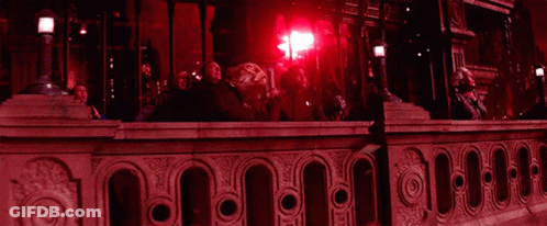 People Looking Up At Red Light GIF