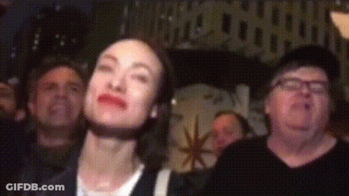 People Looking Up In Dark Room GIF