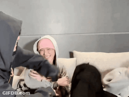 People On Couch, One In Pink Headband GIF