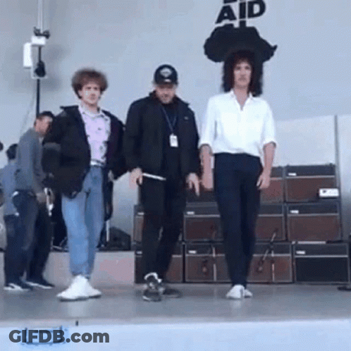 People On Stage Saying Aid GIF