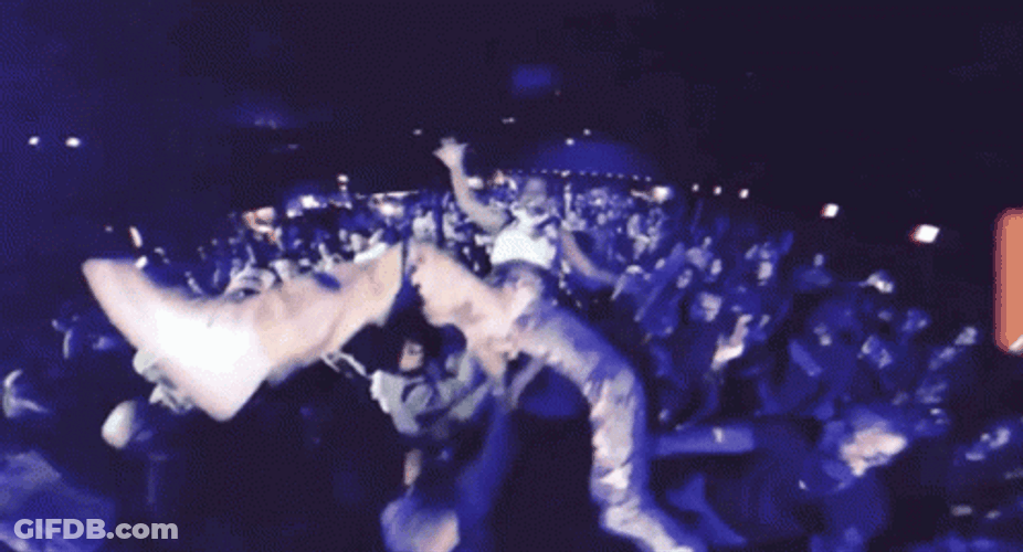 People Passing Singer In Mosh Pit GIF
