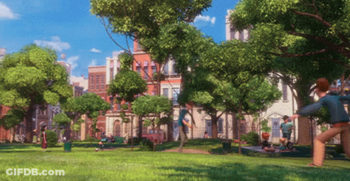 People Playing Frisbee Near Building With A GIF