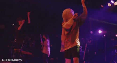 People Playing Instruments On Stage GIF