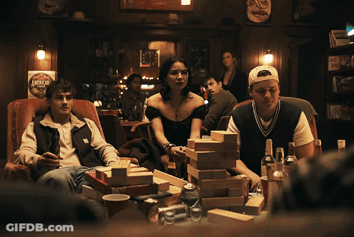 People Playing Jenga In Bar GIF