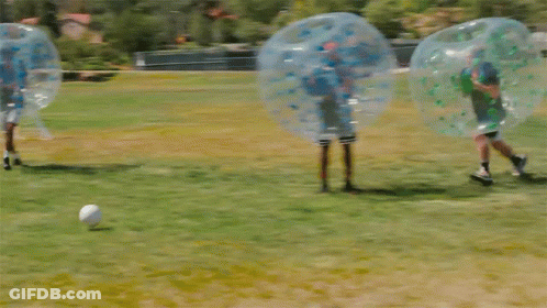 People Playing Soccer In Bubbles GIF