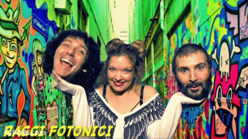 People Posing At Graffiti Wall Raggi Fotonici GIF