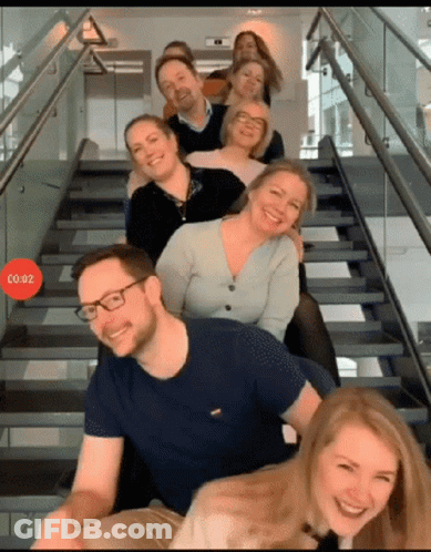 People Posing On Stairs With Red Circle Co.02 GIF