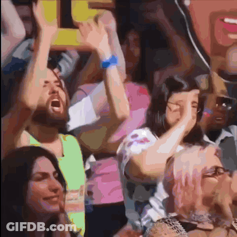 People Raising Arms And Man Holding Sign Saying I GIF