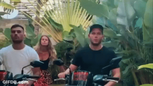 People Riding Motorcycles In Lush Green Forest GIF