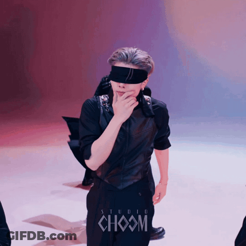 People Running In Desert Under Cloudy Sky GIF