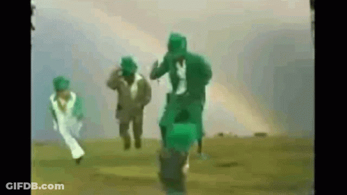 People Running In Field With Green Gas Masks GIF