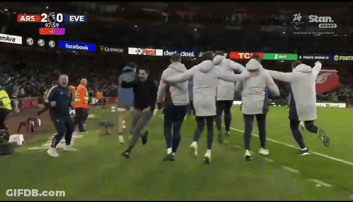 People Running On Soccer Field With Facebook Guinness TCL GIF
