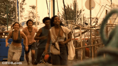 People Running Past No Parking Sign GIF