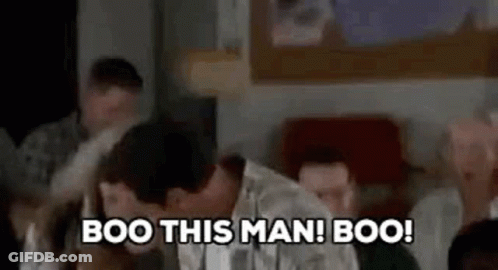 People Sitting Around Table Booing GIF