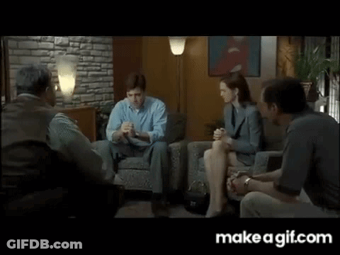 People Sitting Around Table In Living Room GIF