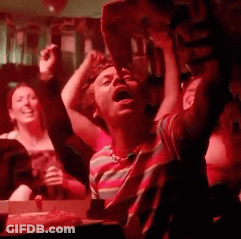People Sitting At Table In Dark Room GIF