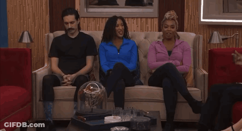 People Sitting At Table With Big Brother GIF
