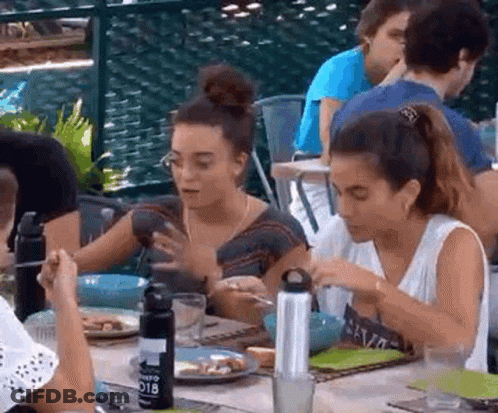 People Sitting At Table With Plates Of Food GIF