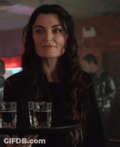 People Sitting At Table With Red Sign GIF
