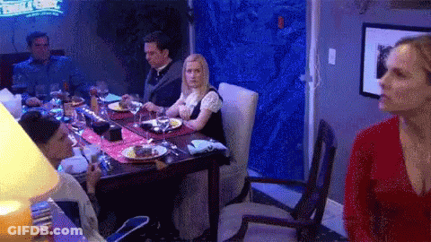 People Sitting At Table With Wine GIF