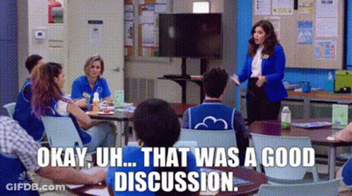 People Sitting At Tables In Classroom GIF