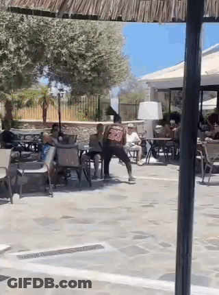 People Sitting At Tables In Restaurant GIF