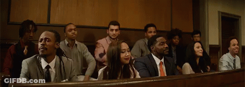 People Sitting In A Row With Hands Up GIF