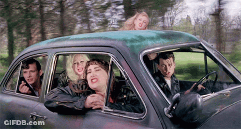 People Sitting In Car With Heads Out Window GIF