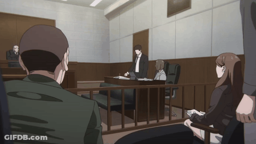 People Sitting In Courtroom Behind Fence GIF
