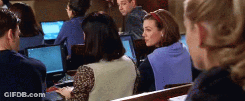 People Sitting In Lecture Hall Using Laptops GIF