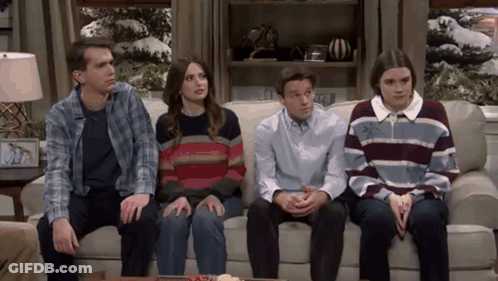People Sitting On Couch In Living Room GIF