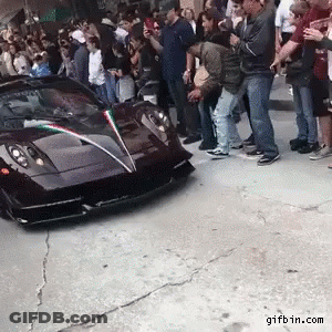 People Standing Around Black Sports Car With Gifbin.com GIF