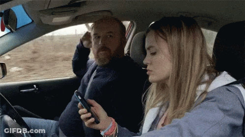 People Standing Around Overturned Car GIF