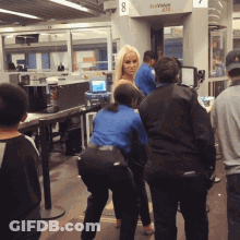 People Standing At Duty Officer Machine GIF