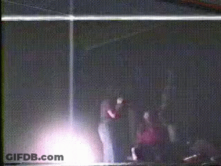 People Standing In Dark Room GIF