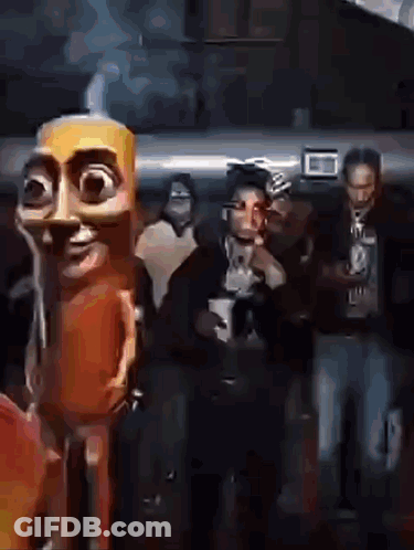 People Standing In Dark Room With Cartoon Character GIF