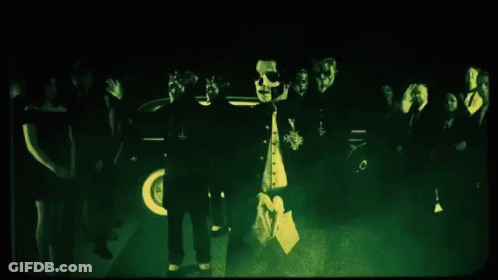 People Standing In Dark Room With Green Light GIF
