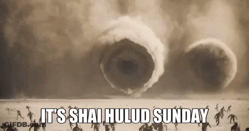People Standing In Desert Facing Giant Worm GIF