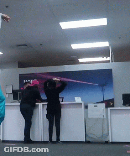 People Standing In Front Of A Sign That Says Hop GIF