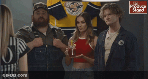 People Standing In Front Of Produce Stand GIF